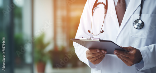 Doctor Writing Prescription - Clinic Blurred Background