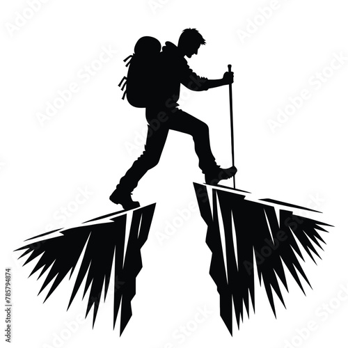 silhouette of a person crossing a narrow ridge during a hike