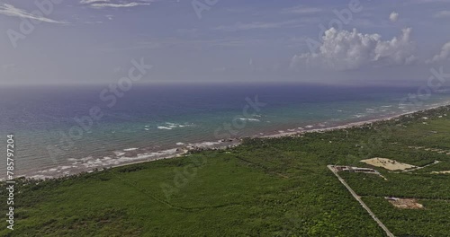 Tulum Mexico Aerial v20 high drone flyover capturing breathtaking views of an oceanfront resort town nestled along sandy beach with pristine ocean views - Shot with Mavic 3 Pro Cine - July 2023 photo