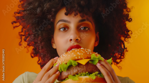 A juicy, mouthwatering burger rests in the model's hands, their expressive face radiating delight and inviting
viewers to savor the moment.