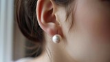 A simple pearl stud earring reflects the minimalistic style and elegant taste of its wearer. .