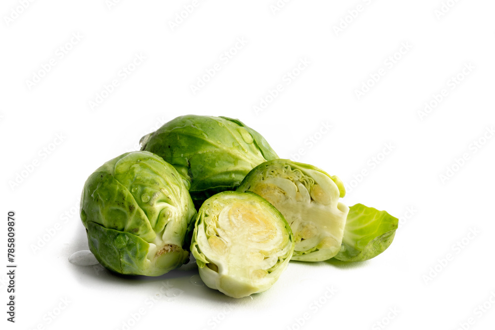 Macro close up of brussels sprouts with one cut in half ready for a salad Macro close up of brussels sprouts with one cut in half ready for a salad