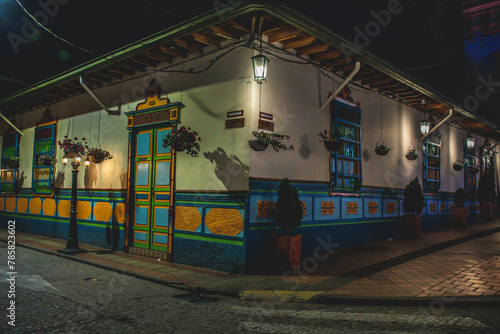 Colorful streets of Guatape, Colombia at night. Painted walls, colorful doors.