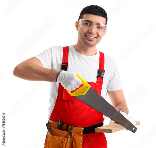 Young carpenter sawing wood...