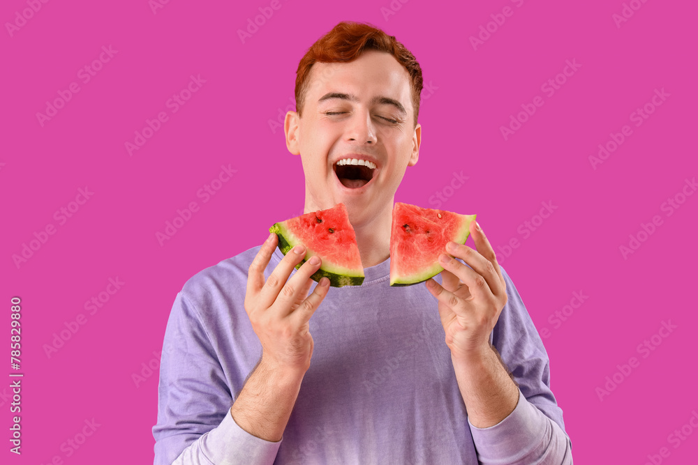 Young redhead man with slices of fresh watermelon on purple background Young redhead man with slices of fresh watermelon on purple background