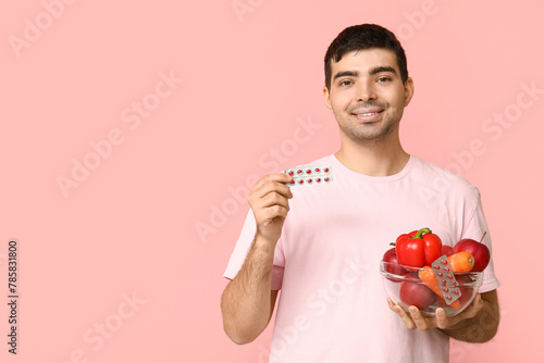 Young man with vitamin A pi...