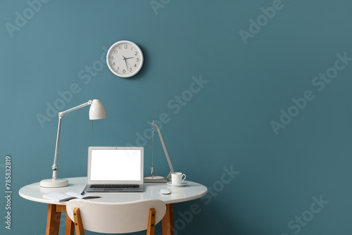 Stylish workplace with mode...
