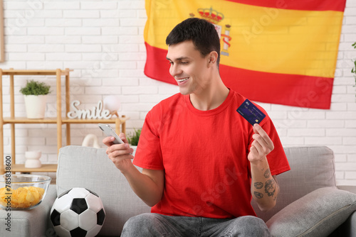 Young man with credit card,...