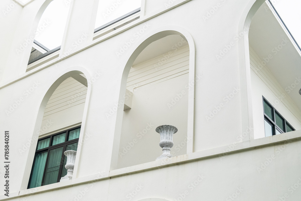 Modern office building white arch wall with street lantern or Streetlights,architecture design,Architectural details of a modern apartment building. Modern office building white arch wall with street lantern or Streetlights,architecture design,Architectural details of a modern apartment building.
