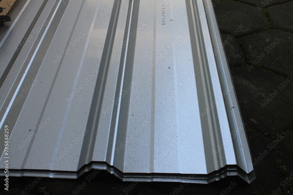 Obraz premium Pile new corrugated iron on top of the paving