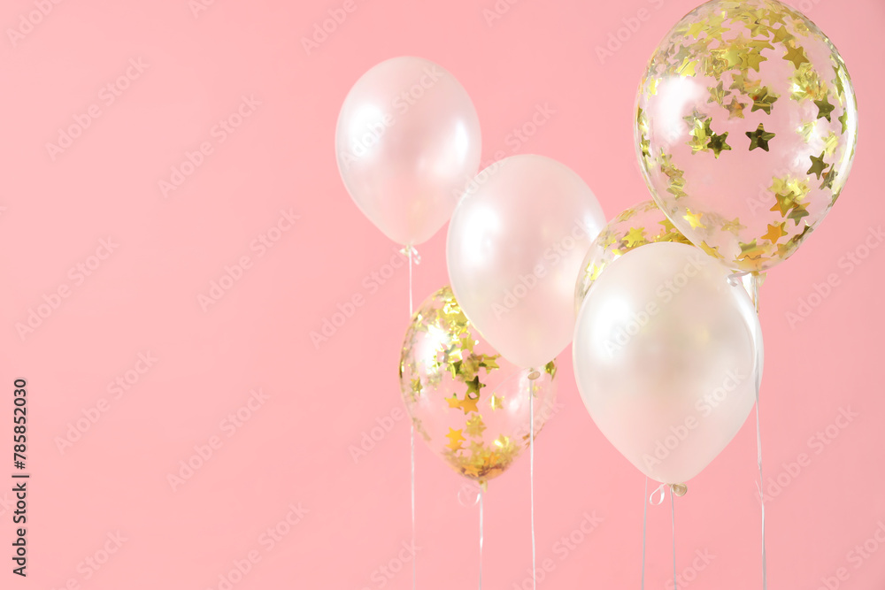 Beautiful balloons on pink background