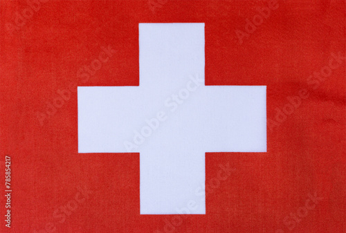 Swiss national flag on a fabric basis in close-up