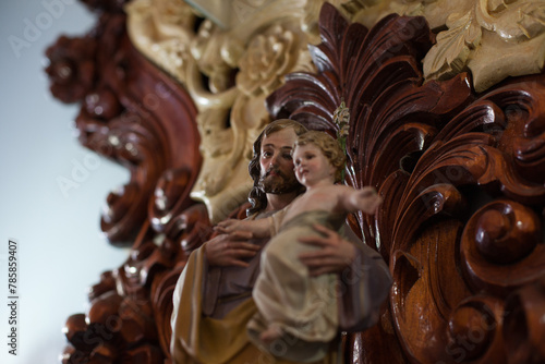 Photo of the sculpture of God the father and Jesus Christ inside a church.