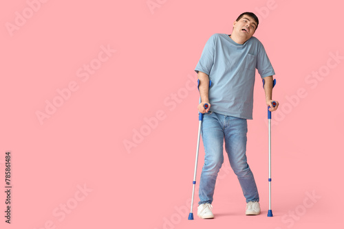 Young man with crutches on ...