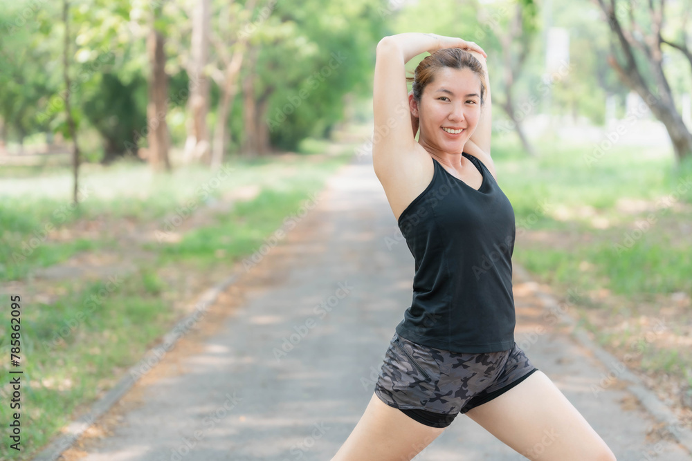 Asian woman stretching before jogging at the park. Health and body care concept. Weight loss, weight loss. Asian woman stretching before jogging at the park. Health and body care concept. Weight loss, weight loss.