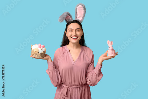 Happy young woman in bunny ...