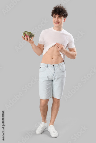 Young man showing toned abd...