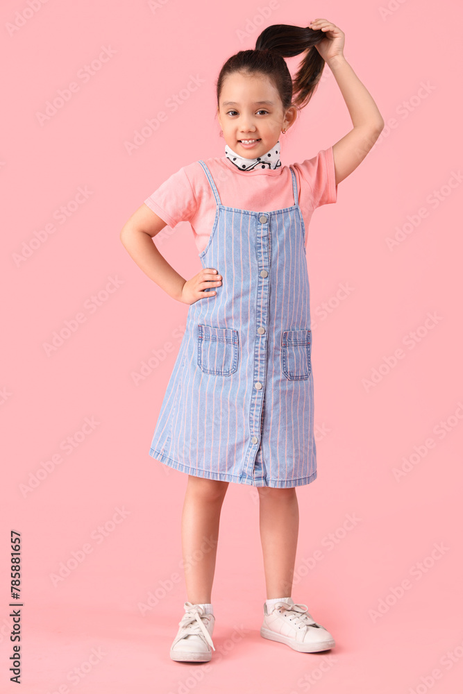 Portrait of fashionable little girl on pink background Portrait of fashionable little girl on pink background