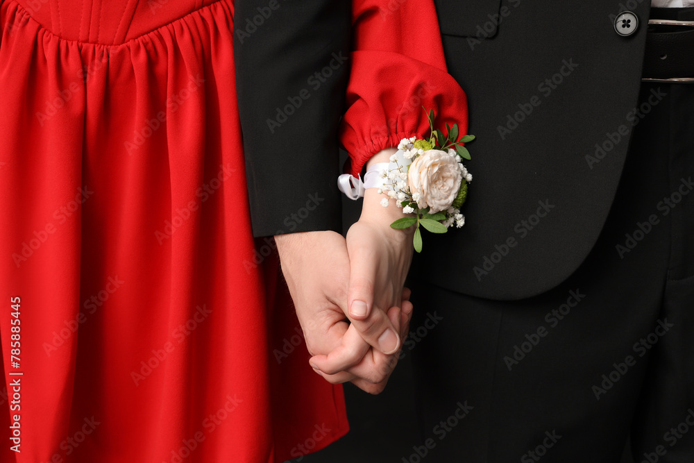 Beautiful couple dressed for prom holding hands, closeup Beautiful couple dressed for prom holding hands, closeup