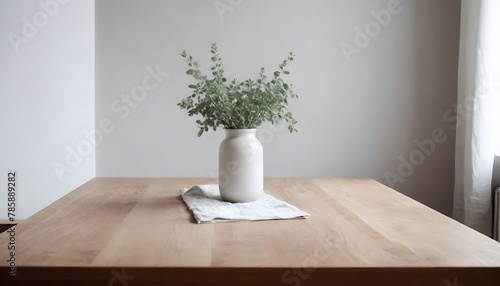Minimal Scandinavian contemporary empty wooden table with sunlight. Simplistic Home office, plant, clean. 