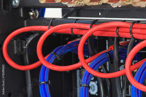 Plastic ties that tighten electrical wiring harnesses. Close-up.