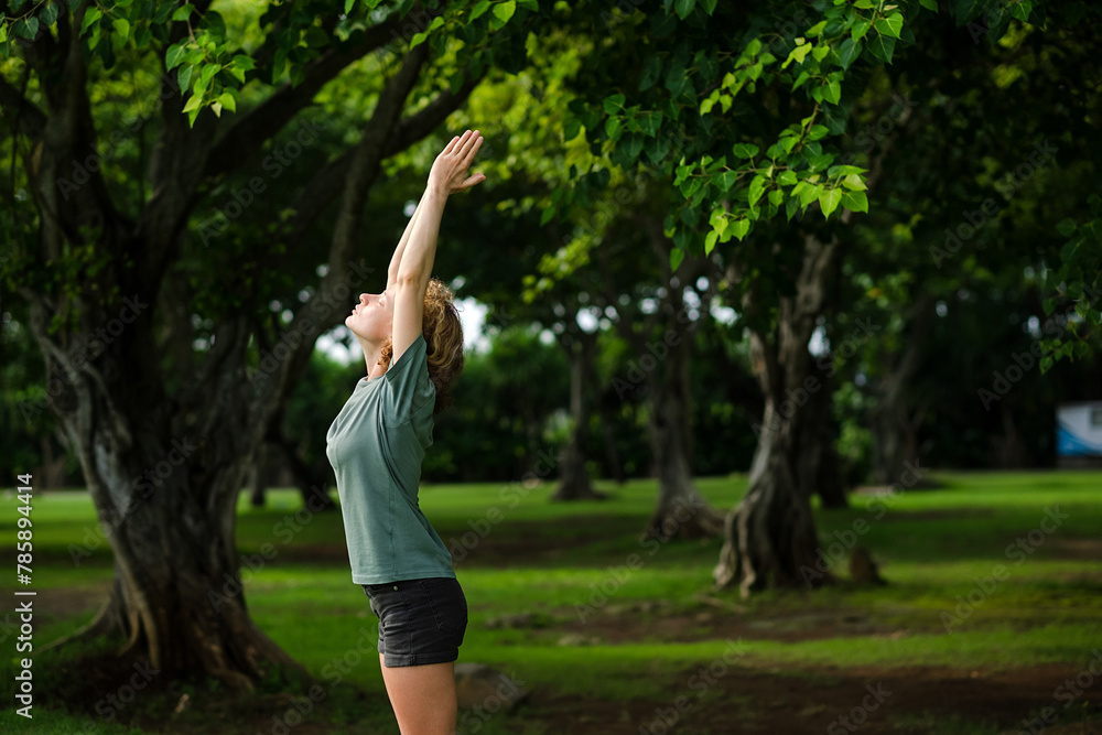 A beautiful young girl of European appearance, blonde with curly hair, is engaged in morning yoga practice. A beautiful young girl of European appearance, blonde with curly hair, is engaged in morning yoga practice.