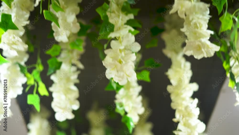 The ceiling is adorned with a stunning arrangement of flowers. The ceiling is adorned with a stunning arrangement of flowers.