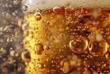 Close-up of beer with bubbles in a glass on a dark background