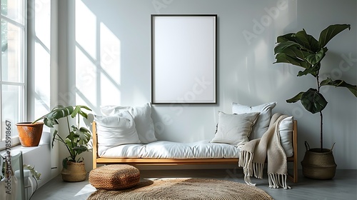 A minimalist, environmentally conscious living room with an empty white frame dominating a soft-colored wall.