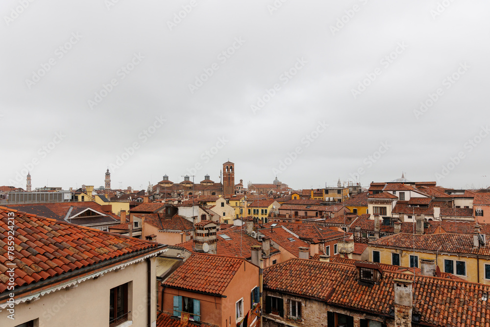 Red rooftop skyline and historic landmarks at cloudy wether in Venice, Italy