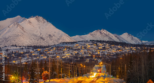 Snow falling on a house in Alaska, cold conditions and natural atmosphere.