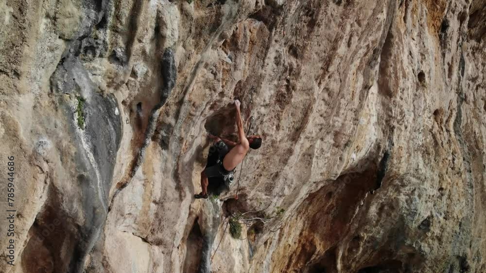 Climber climbing a hard and steep section of the wall and taking a huge fall at Kalymnos island, Greece. High quality 4k footage. Climber climbing a hard and steep section of the wall and taking a huge fall at Kalymnos island, Greece. High quality 4k footage.