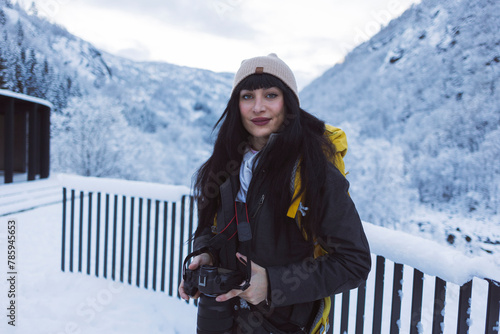 Portrait of a Female Photographer in a Snowy Mountain Setting