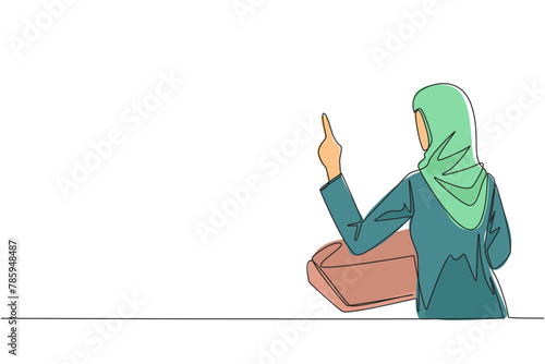 Single one line drawing from back view young Arabian businesswoman speak at podium while lifting index finger. Businessman in Conference Hall present new business. Continuous line graphic illustration