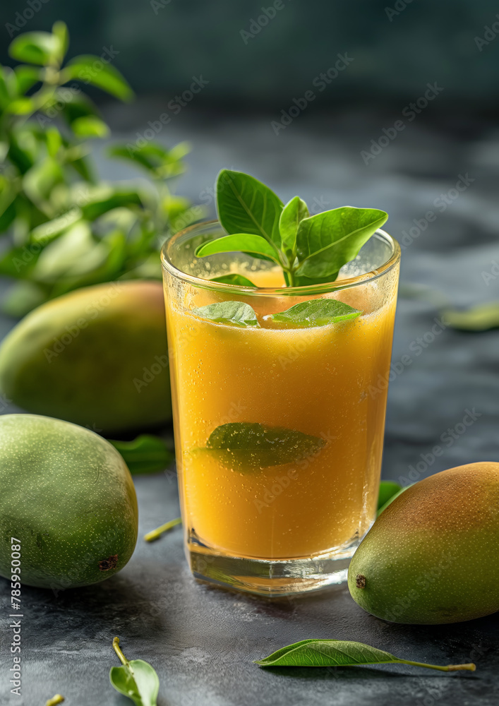 Refreshing Aam Panna: Roasted Raw Mango Juice in a Transparent Glass made with roasted raw mango, spices, mint leaves and ice water Refreshing Aam Panna: Roasted Raw Mango Juice in a Transparent Glass made with roasted raw mango, spices, mint leaves and ice water