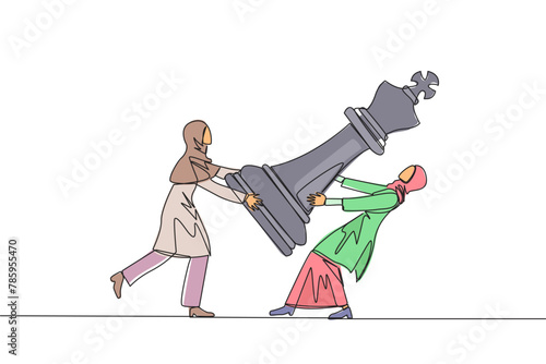 Continuous one line drawing two Arabian businesswoman fight over big king chess pieces. The metaphor of scrambling to save a business by helping investors. Single line draw design vector illustration