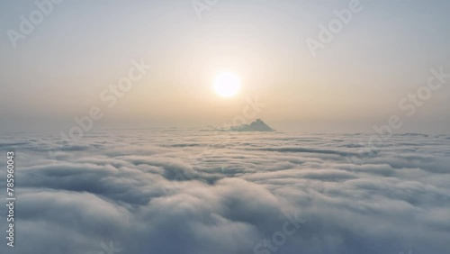 aerial video of low altitude cloudy and foggy weather above the sea of clouds photo