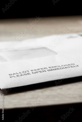 Ballot paper postal vote letter for the Local Elections in England. On a wood table top