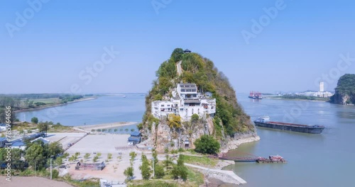 erial time lapse video of the small solitary mountain closeup by Yangtze river, Anhui province, China. photo