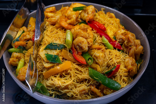 Photography Local asian food, singapore noodle dish with vegetables, fried shrimps and chick