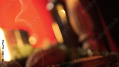 Palo santo aroma stick and its smoke on a decorated table photo