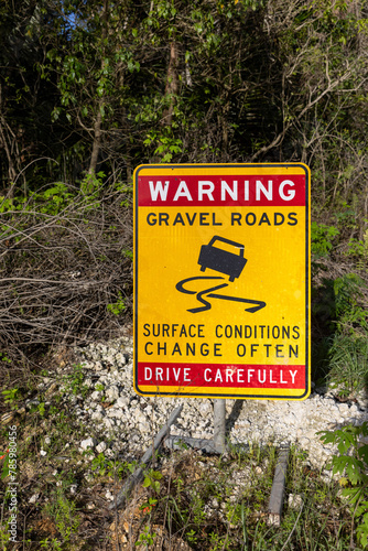 warning sign gravel roads drive carefully