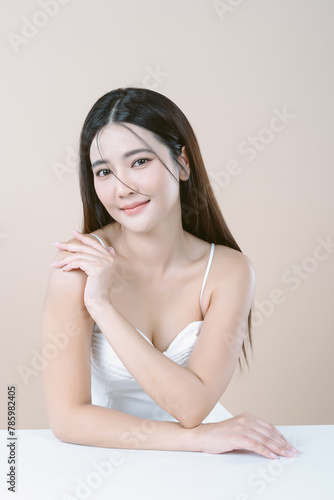Beautiful Asian woman with natural makeup and looking away isolated over white background. Face care, Facial treatment, beauty and spa, Skincare and Cosmetology concept.