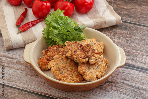 Fried salmonn cutlet in the bowl photo