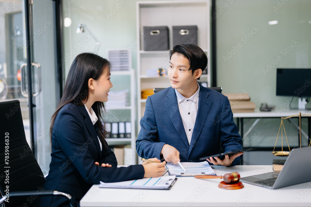 Fototapeta premium business people and lawyers discussing contract papers sitting at the table. Concepts of law, advice, legal services.