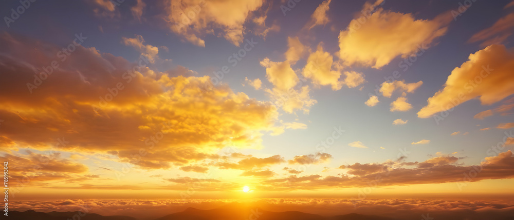 Panoramic of Beautiful morning sky looked like a bright golden sky. The sunrise is decorated with clouds in various shapes.