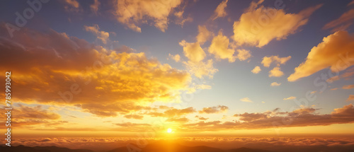 Panoramic of Beautiful morning sky looked like a bright golden sky. The sunrise is decorated with clouds in various shapes. © Rat Art