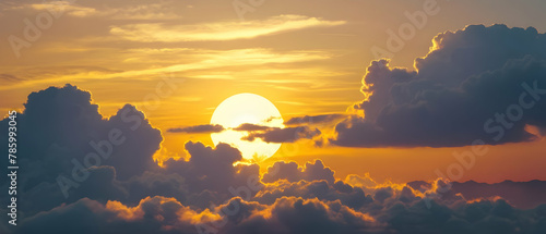 Panoramic of Beautiful morning sky looked like a bright golden sky. The sunrise is decorated with clouds in various shapes.