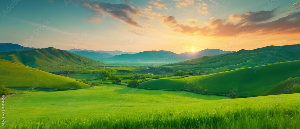 Panorama of Beautiful green valley with green fields with green spring grass with nice hills and mountains and scenic colorful cloudy sunset on background