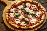 Pizza. Food industry. Italian pizza with mozzarella, fresh basil leaves and tomato sauce on a wooden board. Pizzeria. Melted cheese. Hot, fresh pizza. Dough. Well browned Neapolitan pizza. Yummy